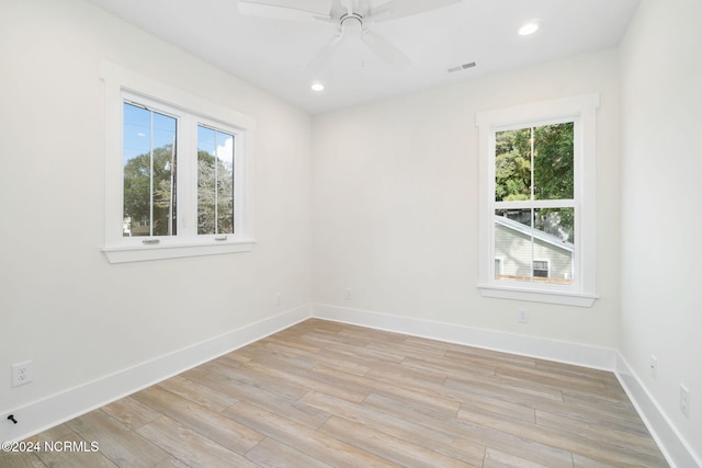 empty room featuring ceiling fan and light wood-type flooring