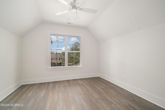 bonus room featuring hardwood / wood-style floors, vaulted ceiling, and ceiling fan