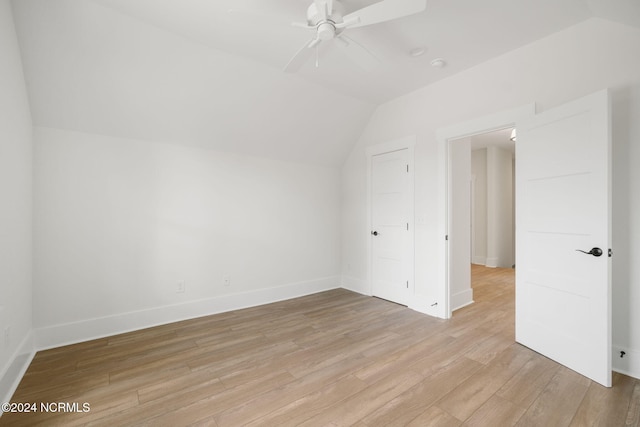 bonus room featuring light hardwood / wood-style floors, ceiling fan, and lofted ceiling