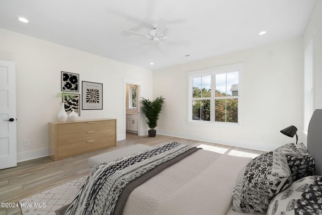 bedroom with ceiling fan and light hardwood / wood-style flooring