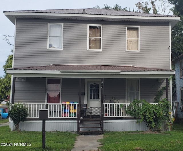 view of front of home featuring a porch and a front lawn