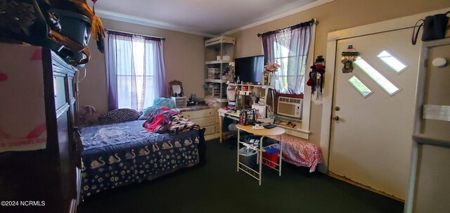 carpeted bedroom featuring crown molding and multiple windows