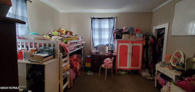 bedroom featuring crown molding and carpet floors