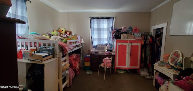 bedroom featuring carpet floors, ornamental molding, and multiple windows