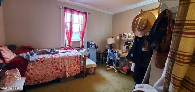 bedroom featuring crown molding, cooling unit, and carpet flooring