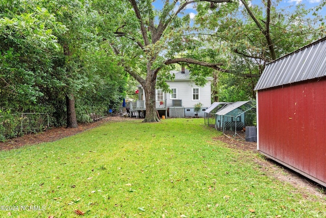 view of yard featuring an outbuilding and central AC unit