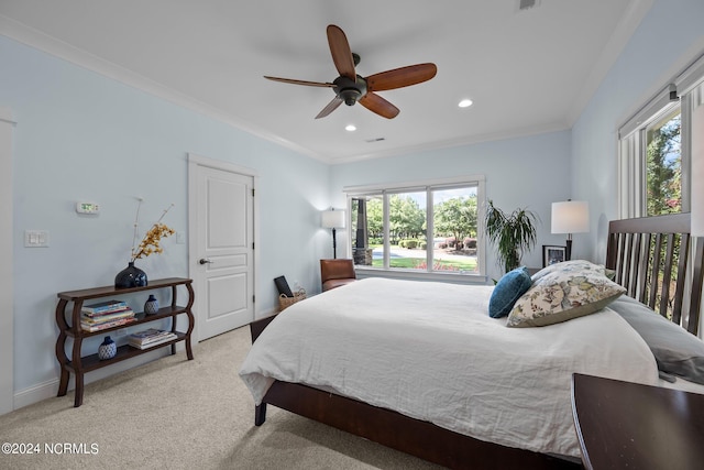 bedroom with crown molding, ceiling fan, and light carpet