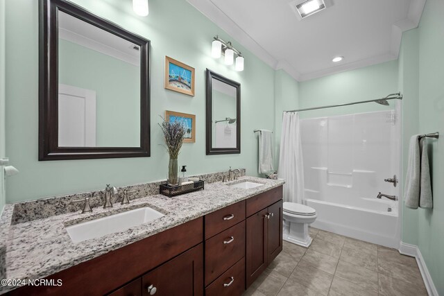 full bathroom featuring vanity, toilet, ornamental molding, tile patterned floors, and shower / bath combo