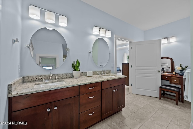 bathroom with double vanity and a sink