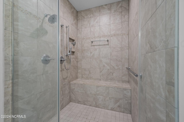 bathroom with a shower with shower door