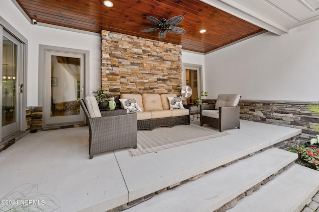 view of patio with outdoor lounge area and a ceiling fan