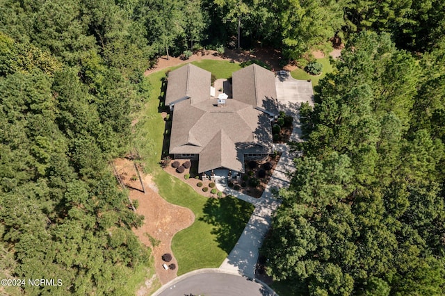 aerial view featuring a wooded view