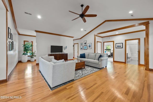 living room featuring lofted ceiling, crown molding, ceiling fan, and light hardwood / wood-style floors