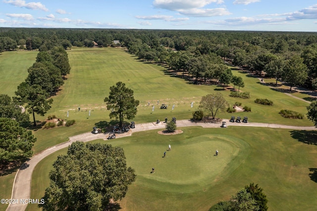 birds eye view of property featuring golf course view and a wooded view