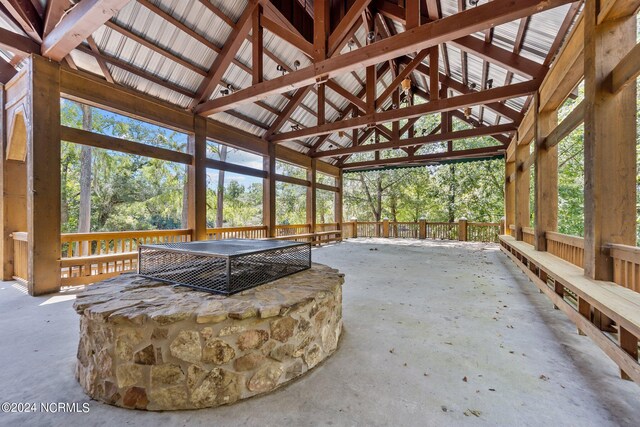 sunroom featuring vaulted ceiling