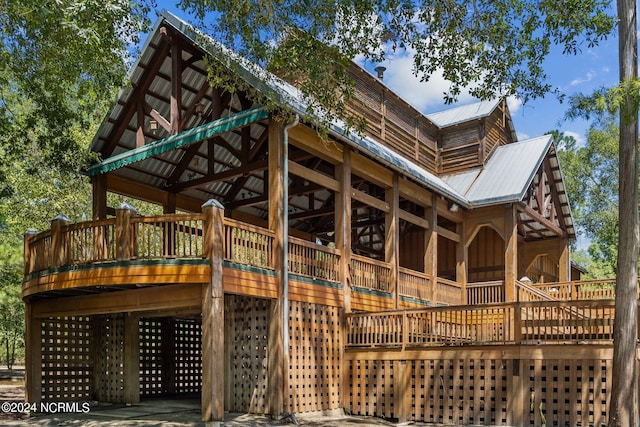 view of side of property with metal roof