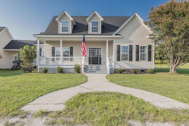 cape cod home featuring a front lawn and covered porch