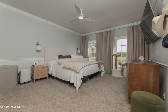 bedroom with light carpet, ceiling fan, and ornamental molding