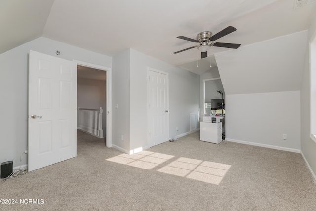 bonus room with ceiling fan, light colored carpet, and vaulted ceiling