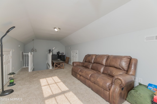 living room with carpet and vaulted ceiling