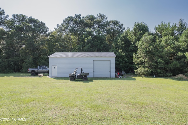 garage featuring a yard