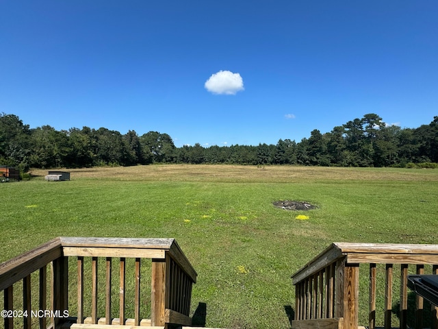 view of yard with a rural view