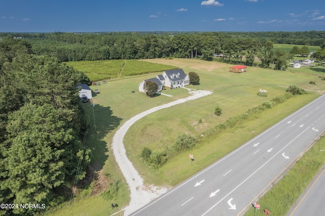 bird's eye view featuring a wooded view