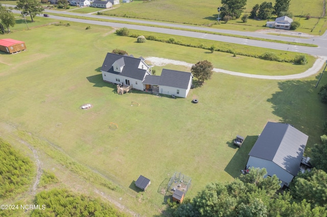 birds eye view of property with a rural view