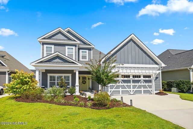 craftsman-style house with covered porch and a front lawn