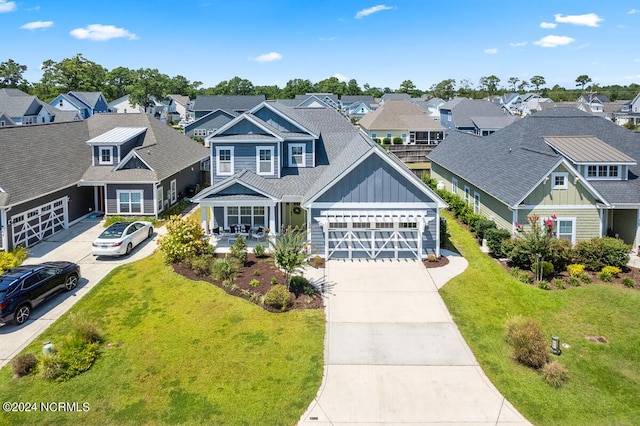 craftsman-style home featuring a garage and a front yard