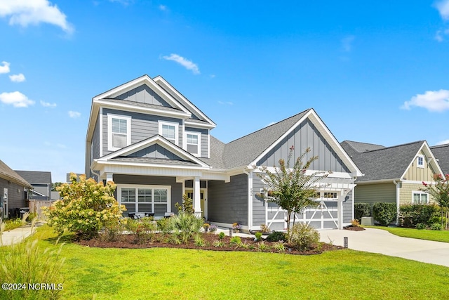 craftsman-style house featuring a garage and a front yard