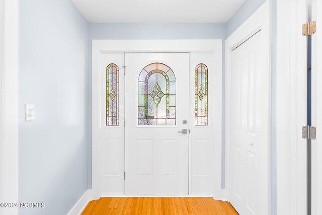 31 Augusta Dr, Oak Island, NC 28465 - foyer entrance with baseboards and light wood-type flooring