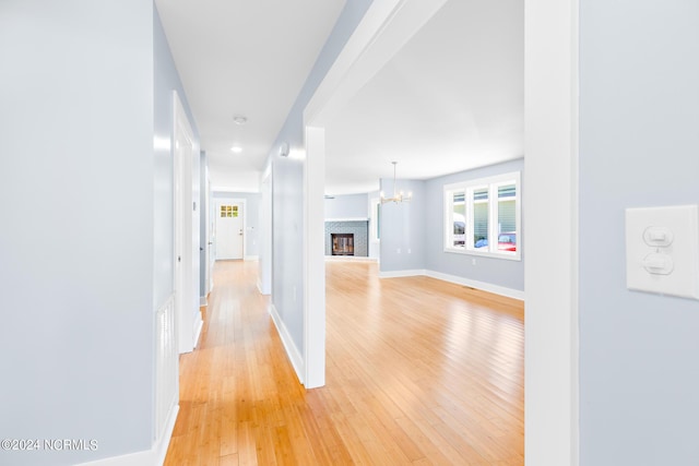31 Augusta Dr, Oak Island, NC 28465 - corridor featuring baseboards, recessed lighting, light wood-style flooring, and a chandelier