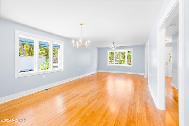 31 Augusta Dr, Oak Island, NC 28465 - unfurnished room with an inviting chandelier, light wood-style floors, visible vents, and baseboards