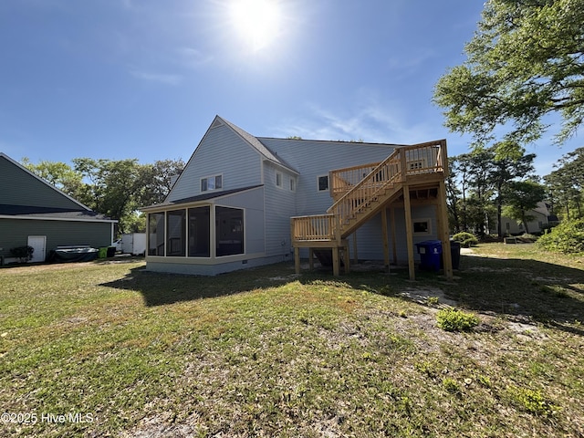 31 Augusta Dr, Oak Island, NC 28465 - rear view of house with a lawn, a deck, stairway, and a sunroom