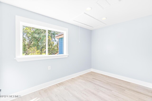 spare room with ceiling fan and light hardwood / wood-style floors