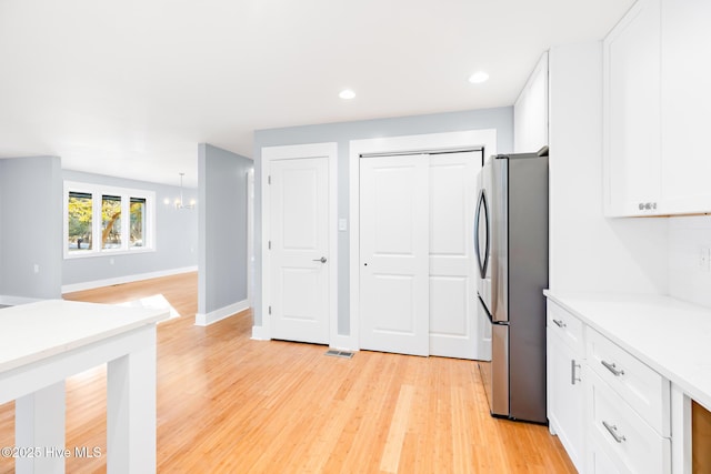 bedroom featuring ceiling fan and light hardwood / wood-style floors