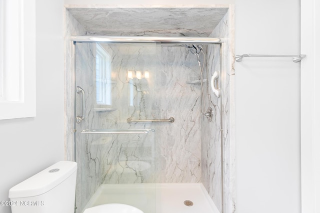 31 Augusta Dr, Oak Island, NC 28465 - bathroom with a marble finish shower and toilet