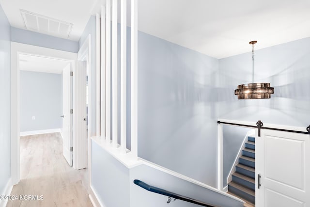 31 Augusta Dr, Oak Island, NC 28465 - hallway featuring light wood-style flooring, baseboards, and visible vents