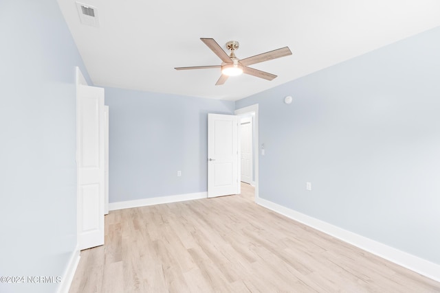 31 Augusta Dr, Oak Island, NC 28465 - spare room with light wood-style floors, visible vents, baseboards, and ceiling fan