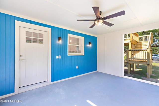 entrance to property featuring a patio and ceiling fan