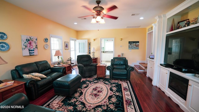 living room with dark wood-style floors, recessed lighting, visible vents, and a ceiling fan