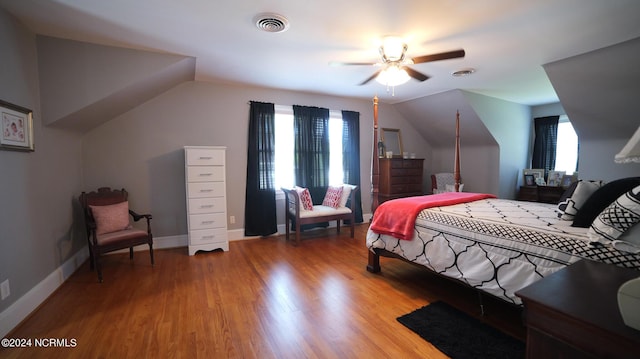 bedroom with multiple windows, light wood-type flooring, and visible vents