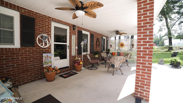 view of patio featuring ceiling fan and a porch