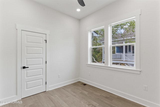 unfurnished room with light hardwood / wood-style floors and ceiling fan