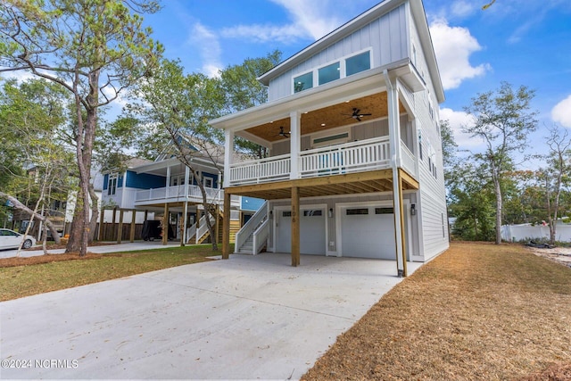 view of front of property with a porch, a garage, and ceiling fan