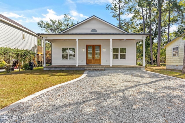 bungalow-style home with a front lawn and a porch