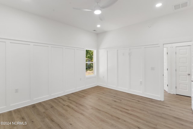 empty room featuring light wood-type flooring and ceiling fan