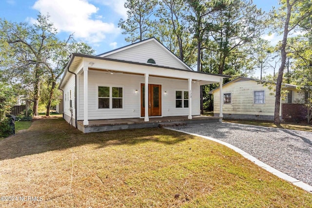 bungalow featuring a front yard and a porch