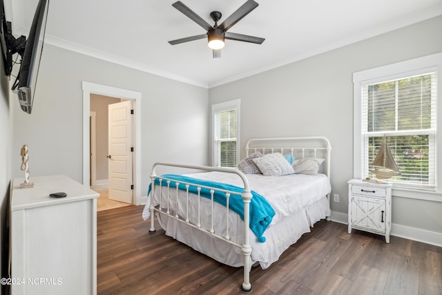 bedroom with multiple windows, ceiling fan, and dark wood-type flooring